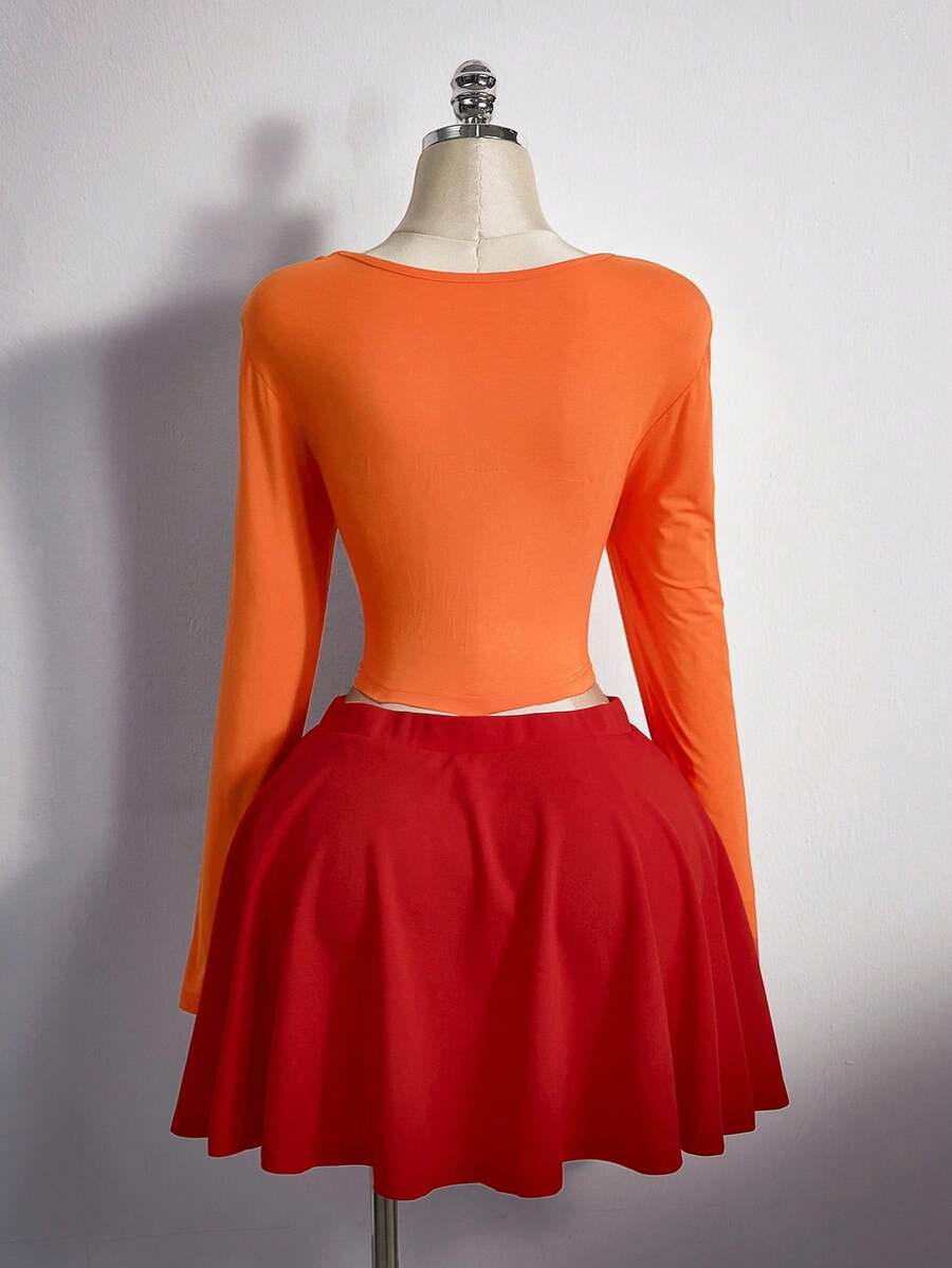 Disfraz Velma, top naranja y falda roja